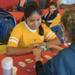 Campers with card game