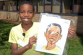 Child holding drawing